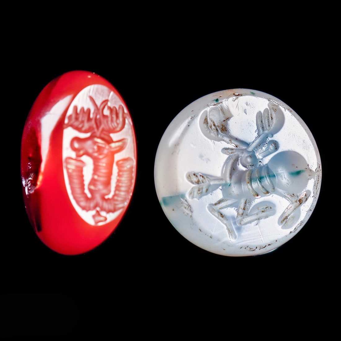 Sasanian Agate & Carnelian Stamp Seals (2): Sasanian Empire, Western Asia, ca. 5th - 6th century CE. Two different stamp seals, including a red-orange carnelian example having a carved stamp impression depicting the profile head of a deer with 