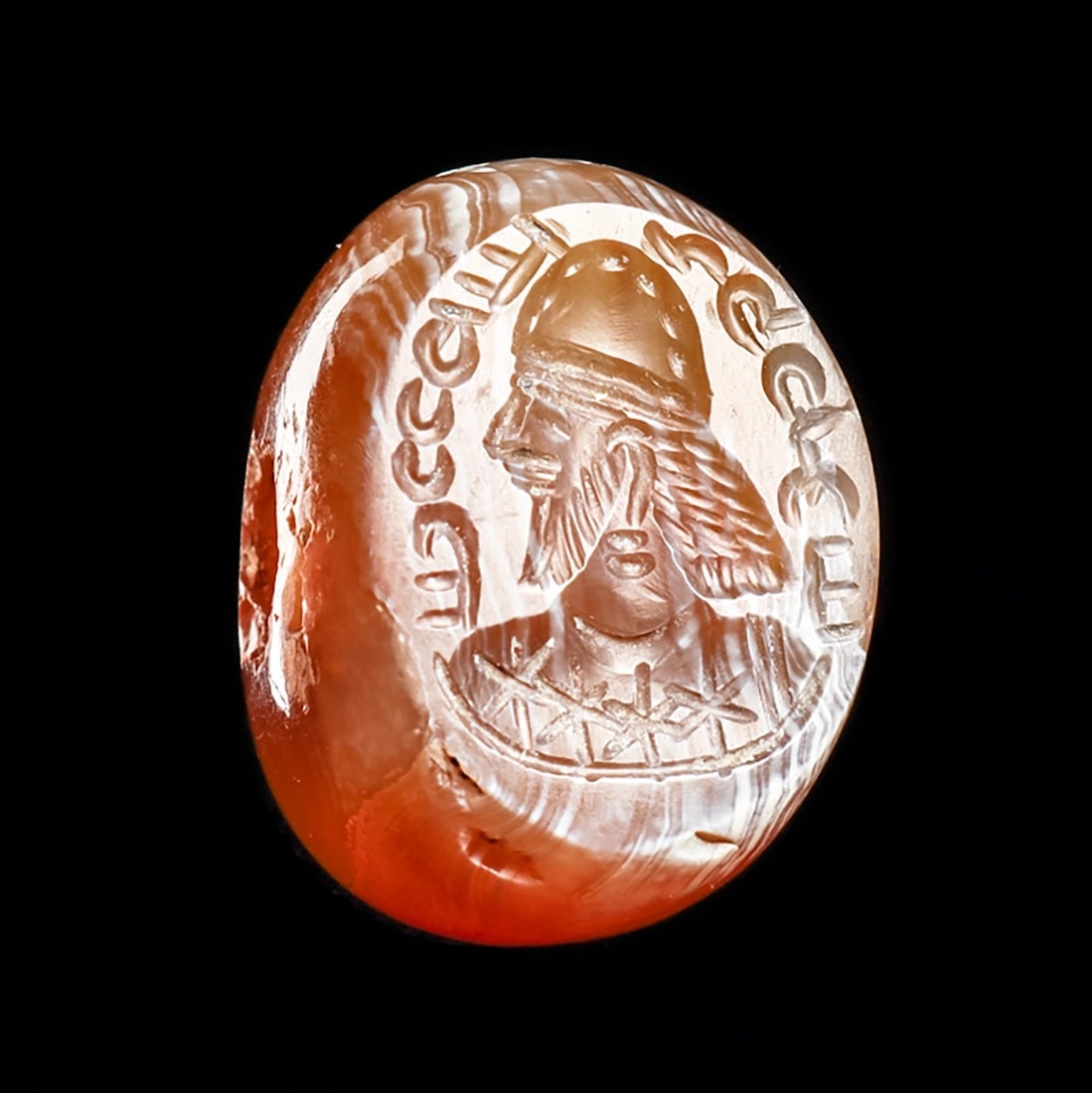 Sasanian Agate Stamp Seal: Sasanian Empire, Western Asia, ca. 5th - 6th century CE. Creamy-tan and white large agate stamp seal, having a carved stamp impression depicting the profile bust of a bearded king wearing a helmet cro