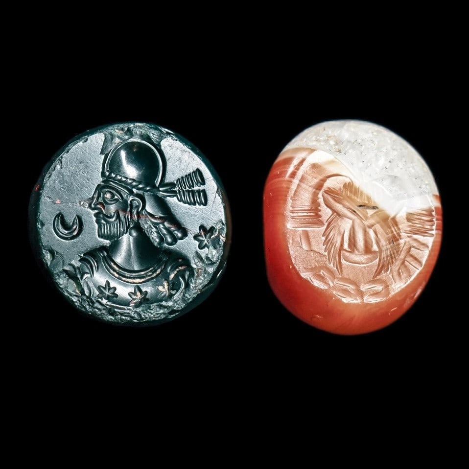Sasanian Stamp Seals (2): Sasanian Empire. Western Asia, ca. 5th - 6th century CE. Two different stamp seals including a green jasper example having a carved stamp impression depicting a profile bust of a king with three stars