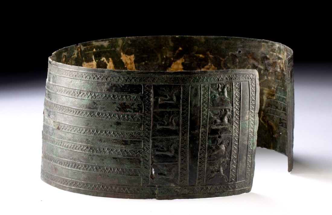 Two Turkish Bronze Torso Armor Pieces: Urartia, modern day Armenia/Turkey., ca. 1000 - 800 BCE. Two sections of ancient bronze armor, probably a part of a protective belt. It has been decorated with a design of 8 horses and warriors, wield