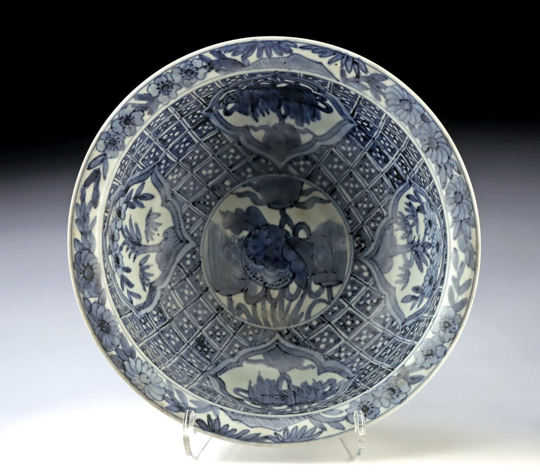 Kangxi Blue and White Porcelain Bowl, Fruiting Branch Roundel: Far East, China, early Qing dynasty., ca. 1600 - 1799 CE. The interior is centered with a fruiting branch—likely pomegranate or peach, symbols of abundance and longevity—enclosed within a 