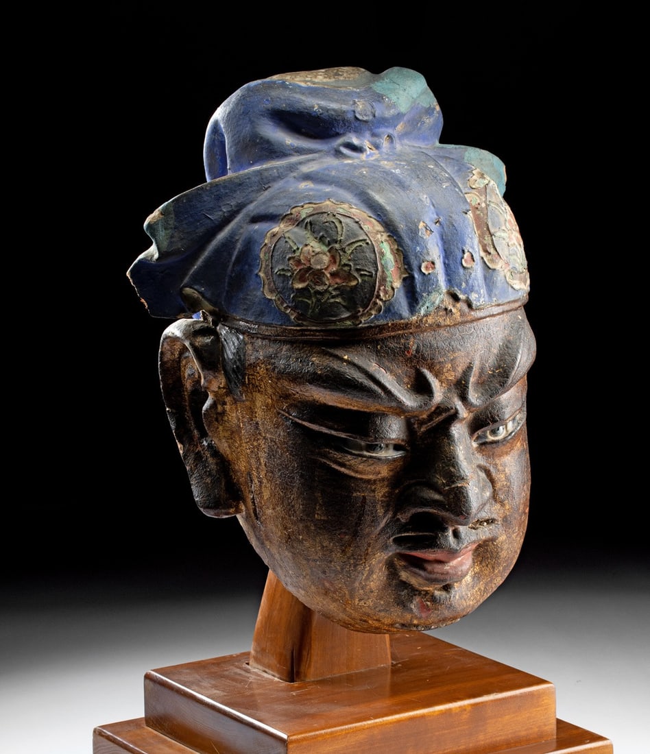 Ming Gilt Stucco Head of an Immortal, CIRAM: East Asia, China, Ming Dynasty., ca. 1368 - 1644 CE. A monumental wood and stucco head of a Buddhist guardian deity commands attention through sheer force of physiognomy, the face set in the controlle