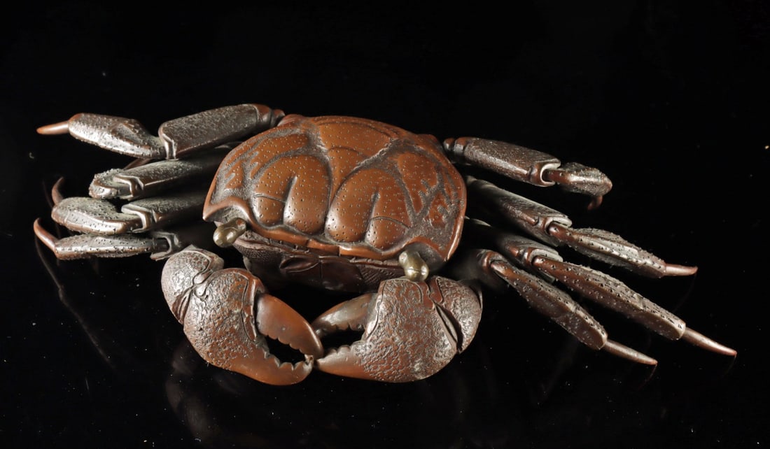 Japanese Bronze Articulated Crab: East Asia, Japan, Meiji period., ca. 1868 - 1912 CE. A bronze articulated model of a crab. Meticulously constructed from numerous hammered plates jointed inside the body to make for a flexible form, t