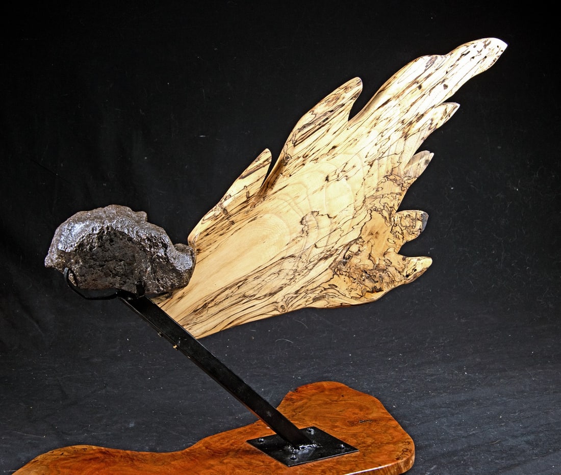 Campo del Cielo Meteorite w/ Wood Stand & Trail: Argentina, Campo del Cielo., ca. 5,000,000,000 - 4,000,000,000 BCE. Large "chunk" of iron meteorite from this massive find site. About 100 tons of meteorites are known to come from the roughly 26 crat