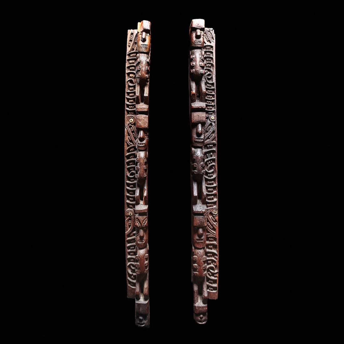Important Maori Whakawae Door Jambs, ex-Sotheby's: New Zealand, 19th cent. “Carved side uprights of a doorway or window opening. Whakawae typically have a forward flange carved with human figures, one on top of the other. And sometimes the flat surf
