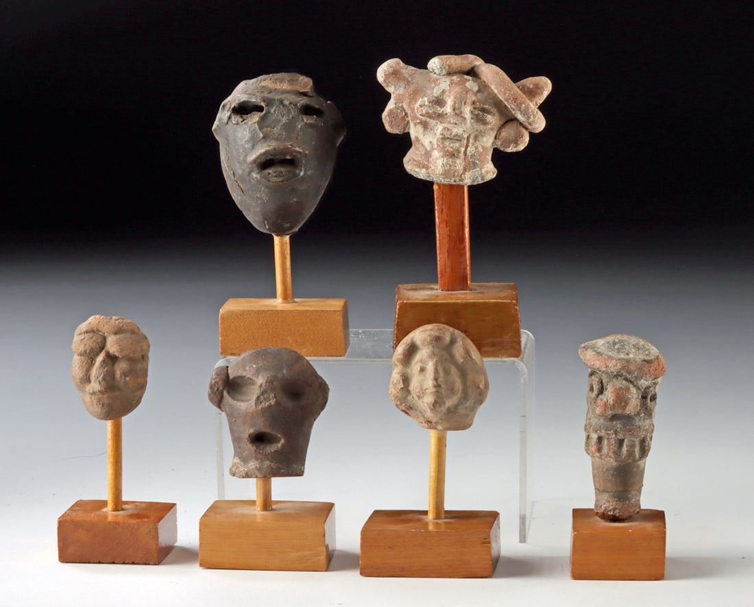 5 Pre-Columbian & 1 Post-Colonial Guatemalan Heads: Pre-Columbian, Guatemala, ca. 200 to 600 CE; Post-Colonial period, ca. 1500 CE. A compelling group of six pottery heads, each a small but expressive study in human form, capturing the enduring presenc