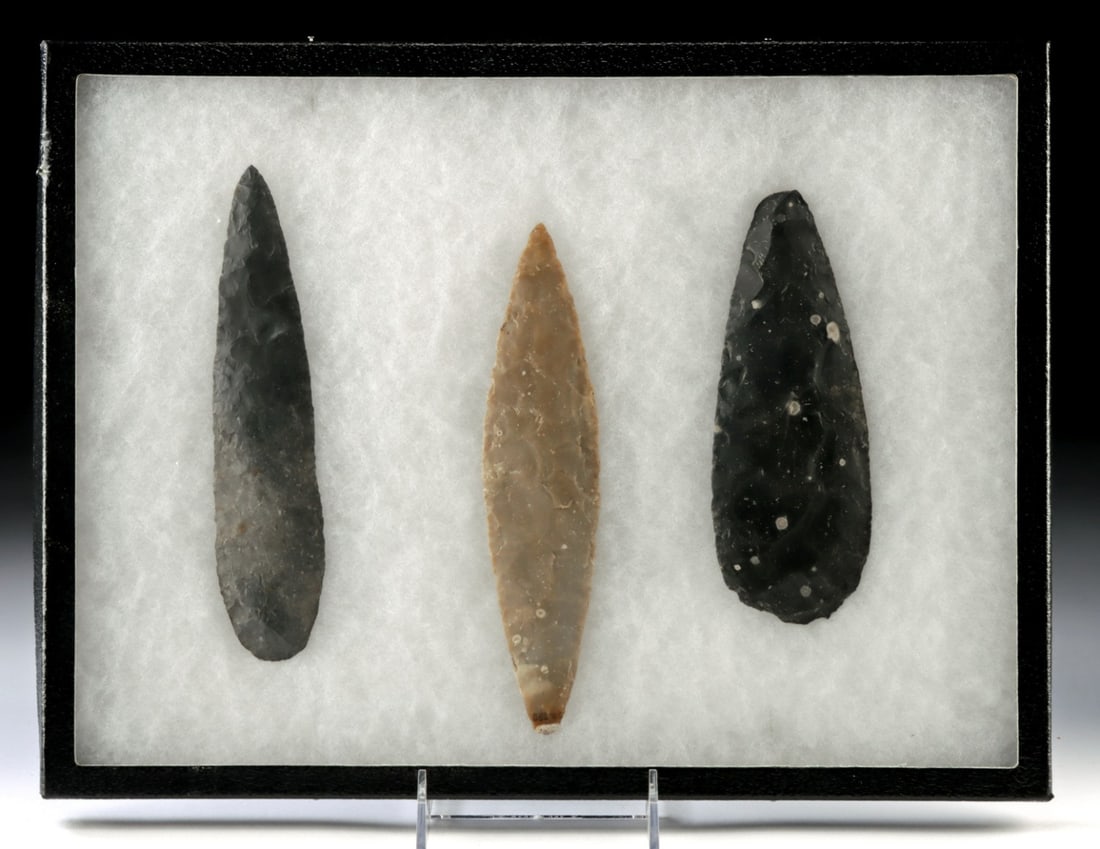 Three Ancient Maya Belize Chert Lanceolate Blades: Pre-Columbian, Belize, Maya culture, Classic Period, ca. 250 to 900 CE. A group of three chert bifacial blades, each carefully pressure-flaked into elongated, lanceolate forms with sharp edges and poi