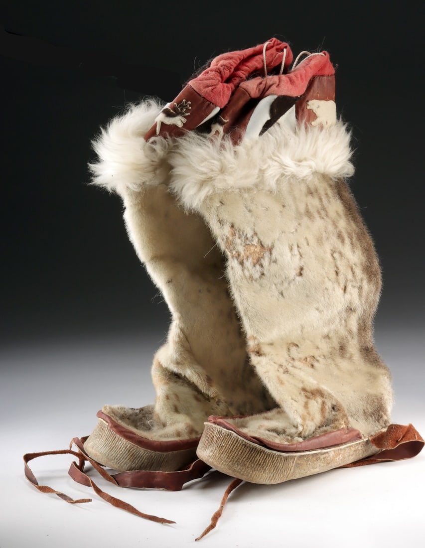 Inuit Seal Fur Mukluks, Bear & Caribou Appliques: Native American, Northwestern United States, Alaska, Inuit-Yupik, ca. early to mid-20th century CE. A pair of handmade mukluks constructed from seal fur, caribou hide, leather, and felt. The exterior 