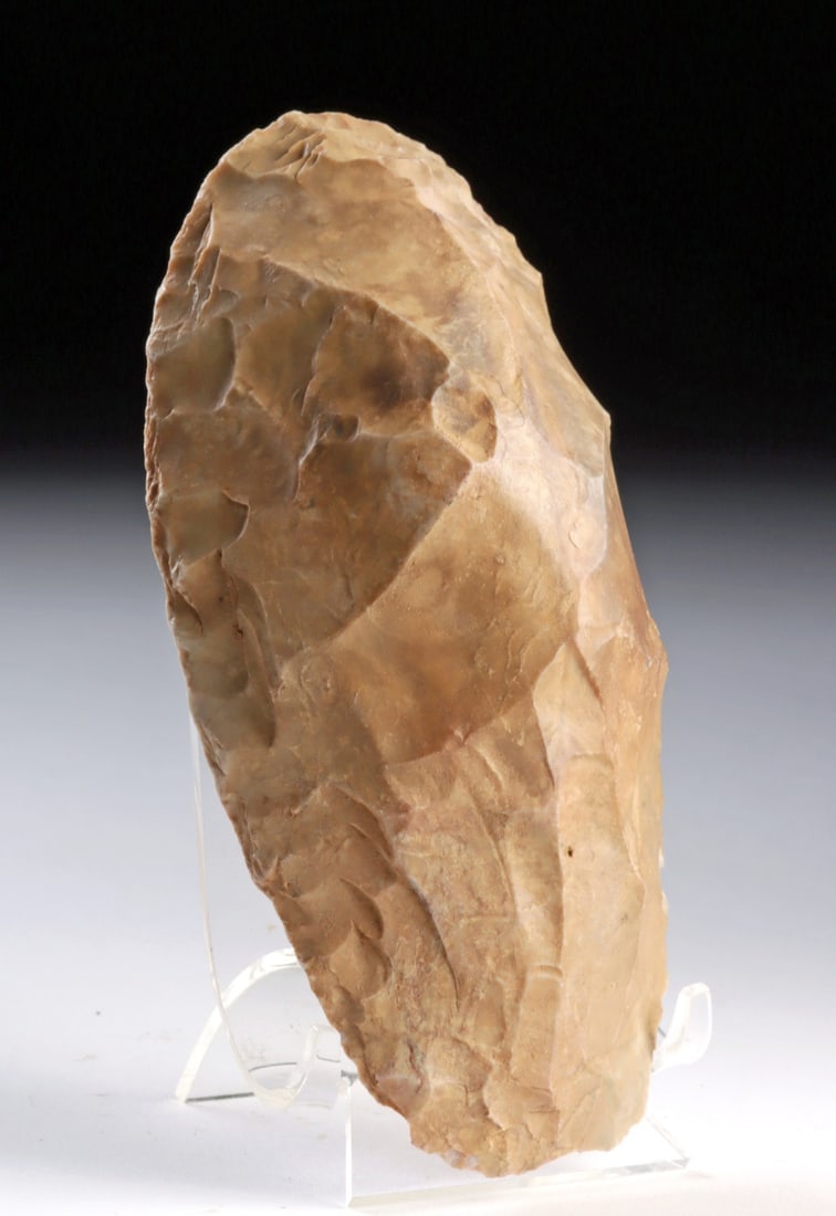Mesolithic African Chert Stone Hand Axe: Northwestern Africa, Upper Paleolithic to Mesolithic Period, ca. 24,000 to 8,000 years ago. This prehistoric chert stone tool is worked into an oval, hand-held form with a convex face and a flatter re