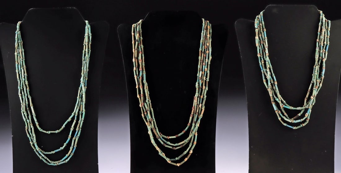Three Multistrand Egyptian Ancient Faience Necklaces: Egypt, New Kingdom to Late Period, ca. 1550 to 332 BCE. A group of three wearable necklaces composed of ancient faience beads in soft turquoise and green hues, interspersed with small disc and seed sh