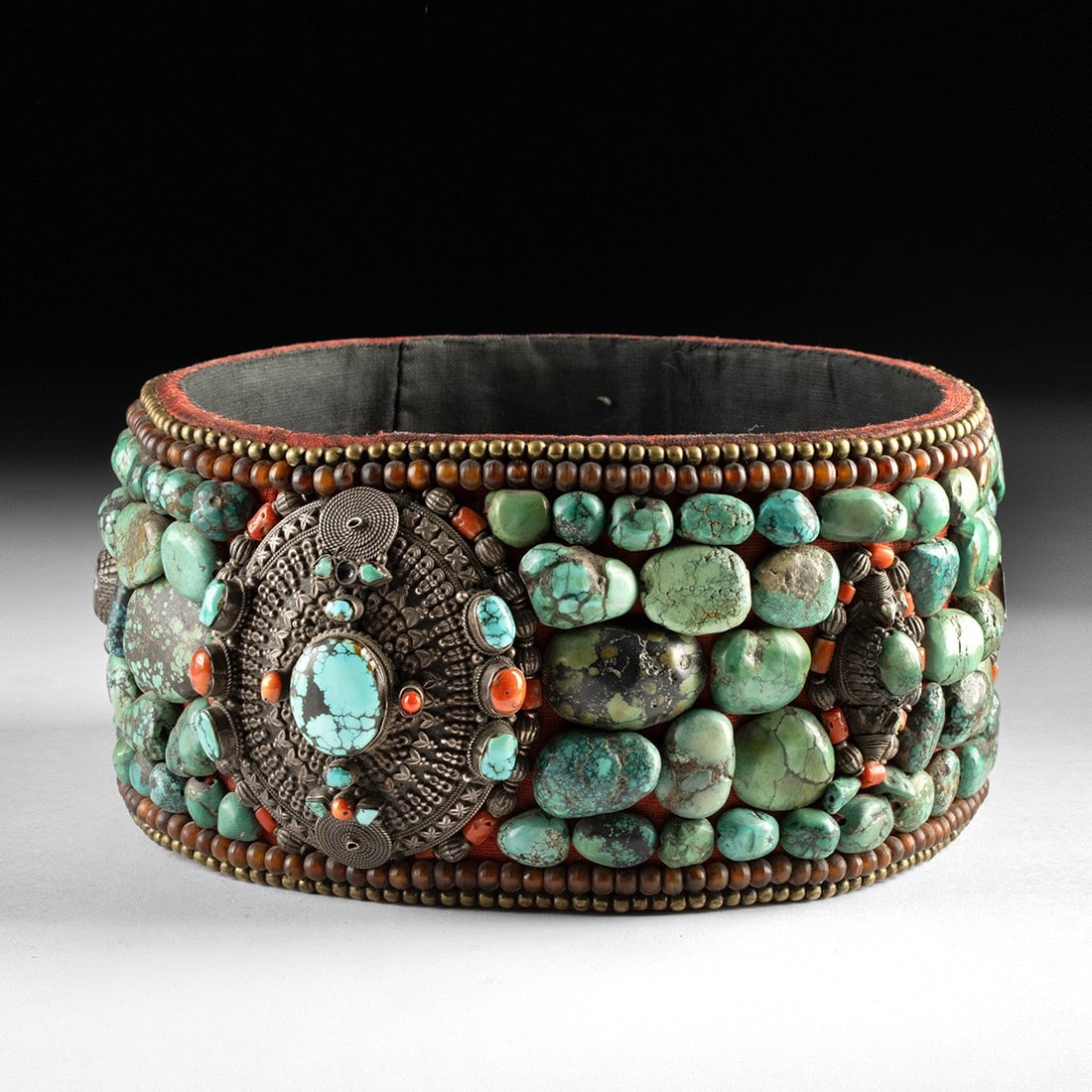 Indian Turquoise & Silver Perak Headdress: Central Asia, Northern India, Ladakh / Tibet region, ca. mid-20th century CE.. A Ladakhi perak headdress, representing the front headband section of this traditional women's adornment, constructed on 