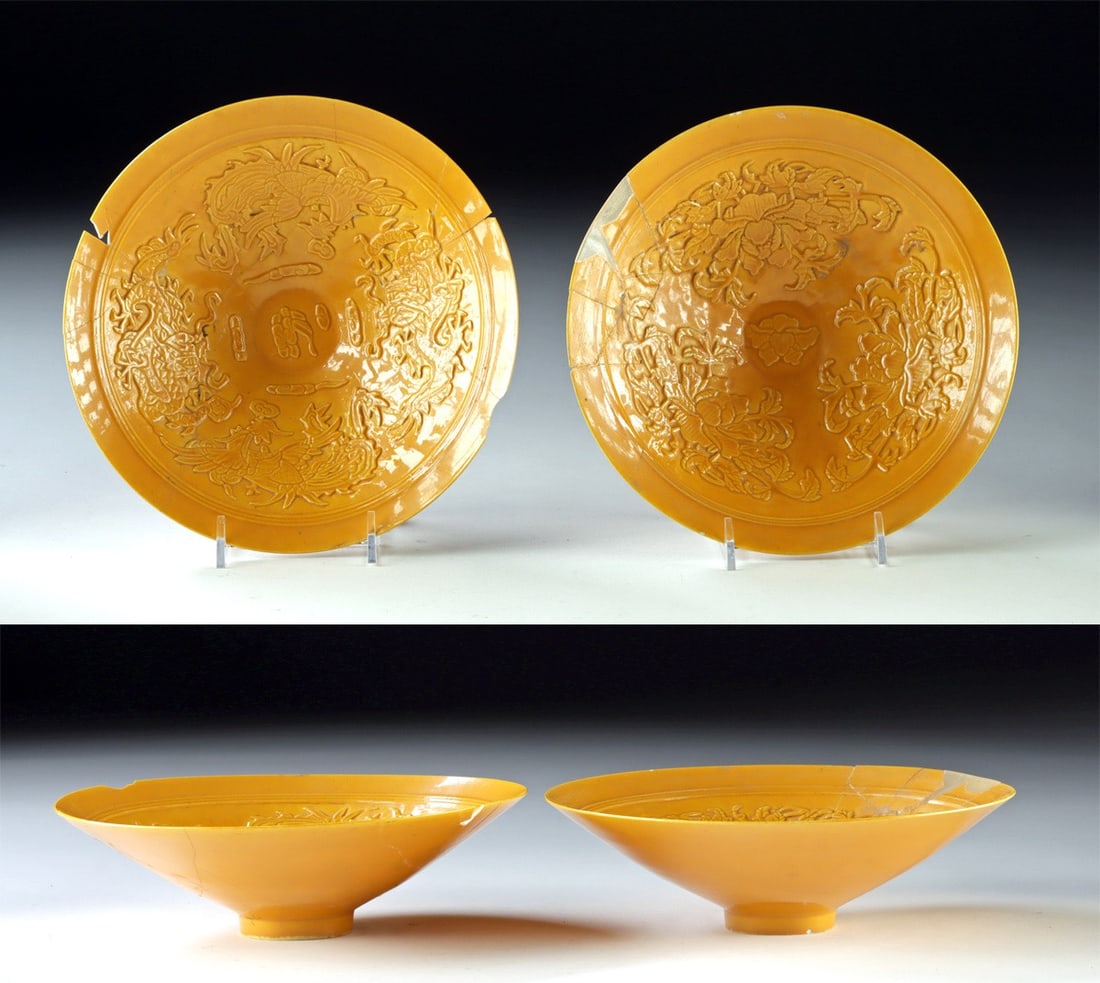 Two Chinese Yellow Porcelain Bowls, 1910 Xuantong Mark: East Asia, China, late Qing Dynasty, ca. 1910 CE. A pair of mustard yellow glazed porcelain bowls of identical form, each with a gently flaring profile and raised foot. Though similar in size and shap