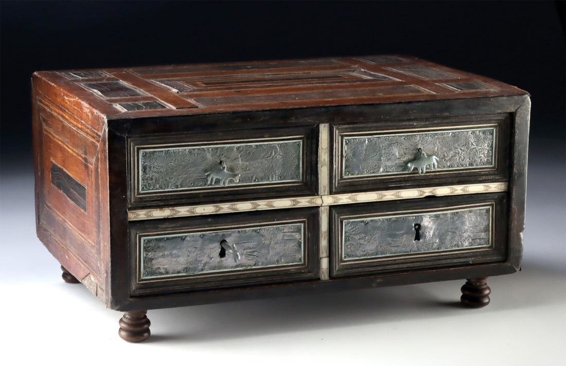 Spanish Colonial Marquetry Box, Silver + Ivory Inlays: Latin to South America, Spanish Colonial era, ca. 18th to 19th century CE. A lovely marquetry storage box constructed with ebony and mahogany veneers, inlaid with contrasting honey-toned hardwood, ele
