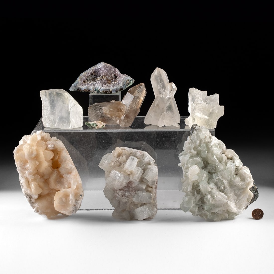 Crystal & Mineral Specimens: Amethyst, Stilbite, Quartz & Calcite: North America & Asia, India, ca. millions of years ago. A collection of eight crystal and mineral specimens representing some of the most collectible forms in the natural world. The group includes an 