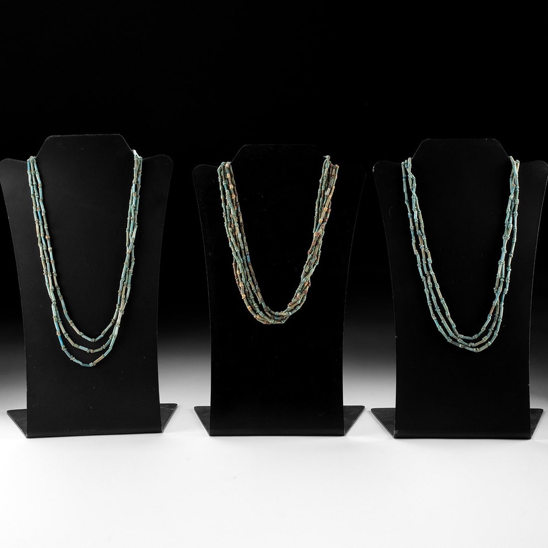 Late Dynastic Faience Necklaces - Group of 3: Egypt, Late Dynastic Period, ca. 664 to 332 BCE. A graceful trio of Egyptian faience bead necklaces in soft blue-green hues, composed of tubular and disk beads and restrung in modern times for wear, p