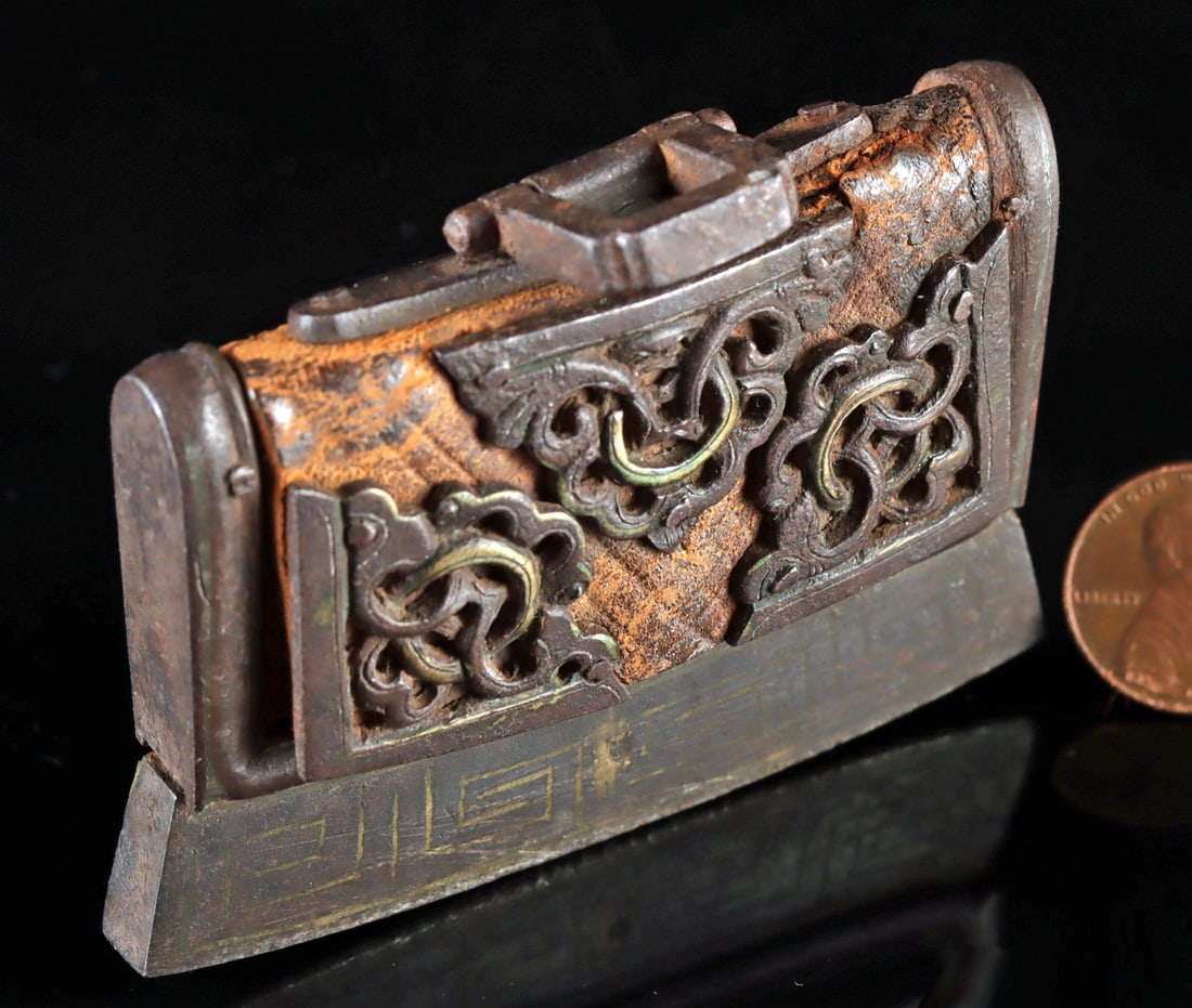 Early Tibetan Iron & Leather Firestarter Flint Pouch: Central Asia, Tibet, ca. 19th to early 20th century CE. A fire-starting pouch known as a mechag or chuckmuck, consisting of an iron and iron-copper alloy frame and leather. A thick, protruding iron pi