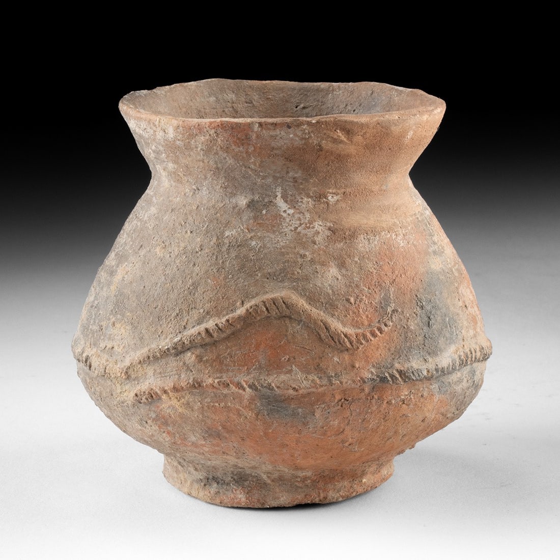 Ban Chiang Terracotta Jar - Carinated Vessel with Incised Band: Southeast Asia, Thailand, Ban Chiang culture, ca. 1000–300 BCE. A globular earthenware jar rising from a rounded body to a sharply everted, flaring rim, its profile carinated at the shoulder in 