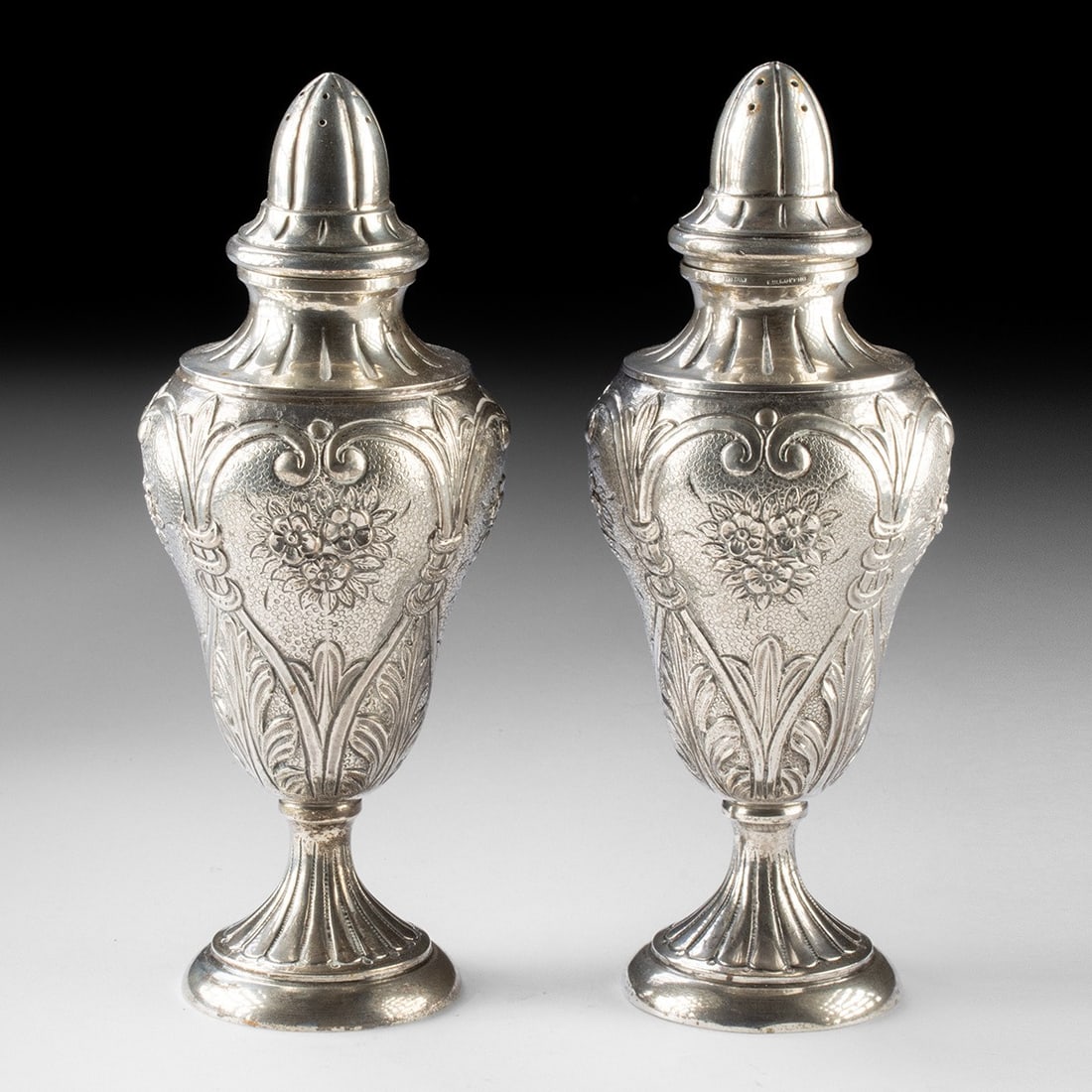Italian 800 Silver Salt & Pepper Shakers - Fratelli Coppini, Florence: Europe, Italy, Florence, Fratelli Coppini, ca. 1900–1940 CE. A pair of urn-form silver casters that translate the vocabulary of the Italian Renaissance into the intimacy of the dinner table. Eac