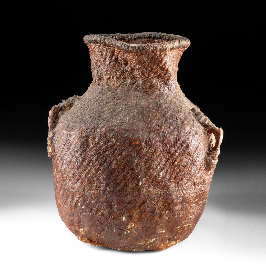 Apache Pinon-Pitched Tus Water Basket: Native American, Southwestern United States, Apache, ca. 1880–1920 CE. A basketry water jar, or "tus," twined from willow and sumac and covered in pine pitch that renders the vessel watertight. 