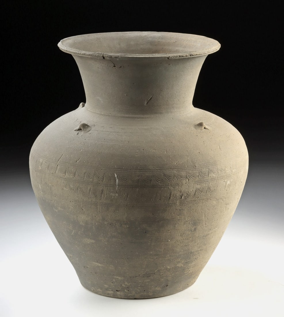 14th C. Thai Sawankhalok Pottery Jar, ex-Museum: Southeast Asia, Thailand, Sukhothai Period, Sawankhalok (Si Satchanalai), ca. 14th to 16th century CE. A splendid and sizeable buffware pottery jar with robust shoulders, flared walls, and a flat circ