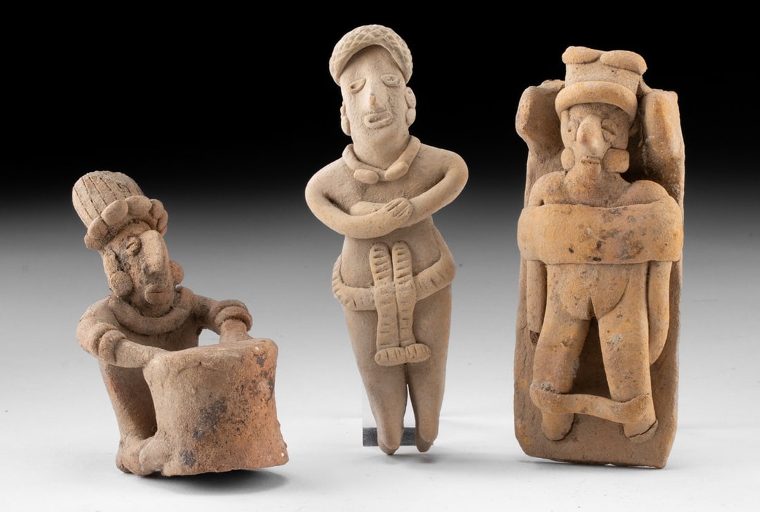 3 Colima Figures - Standing Male, Drummer, Bound Female: Pre-Columbian, West Mexico, Colima, ca. 300 BCE to 300 CE. A group of three pottery figures. The largest stands upright, wearing a loincloth, arms folded across the chest, with incised details and car