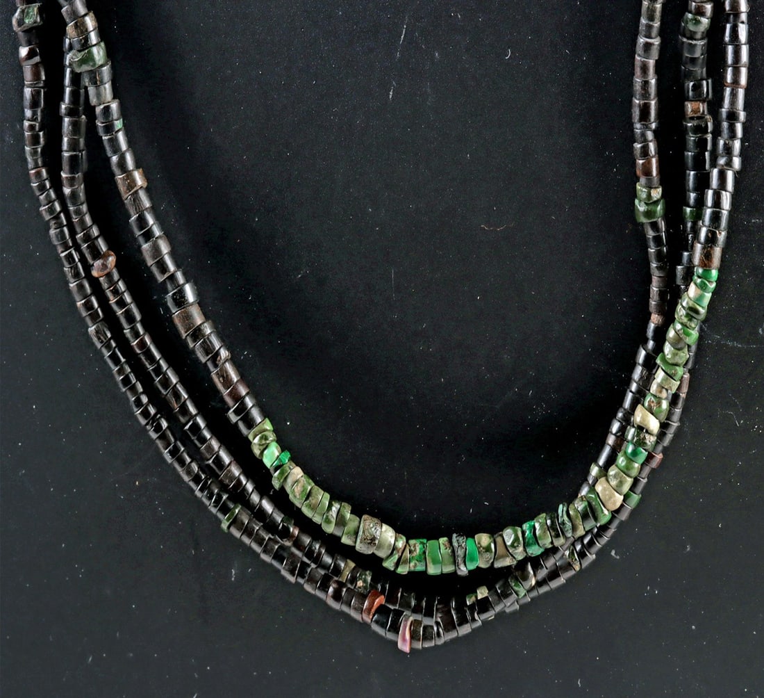 Pre-Columbian Necklace - Turquoise & Black Stones: Pre-Columbian, ca. 500 BCE to 1500 CE. An elegant and wearable necklace composed of three strands of ancient Pre-Columbian beads, skillfully restrung on modern wire and finished with a hand-forged vol