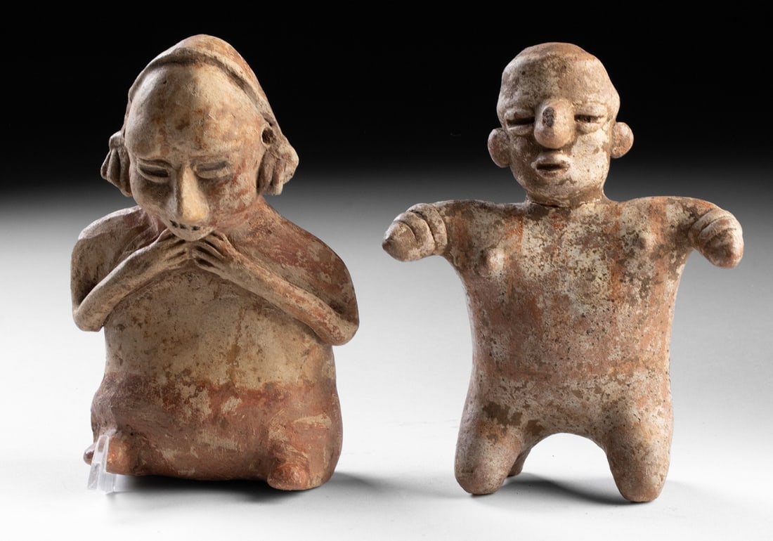 Pair of Jalisco Pottery Figures, West Mexico: Pre-Columbian, West Mexico, Jalisco, ca. 300 BCE to 300 CE. A compelling and expressive pair of Jalisco pottery figures, unified by material and scale yet differentiated by posture, gesture, and adorn