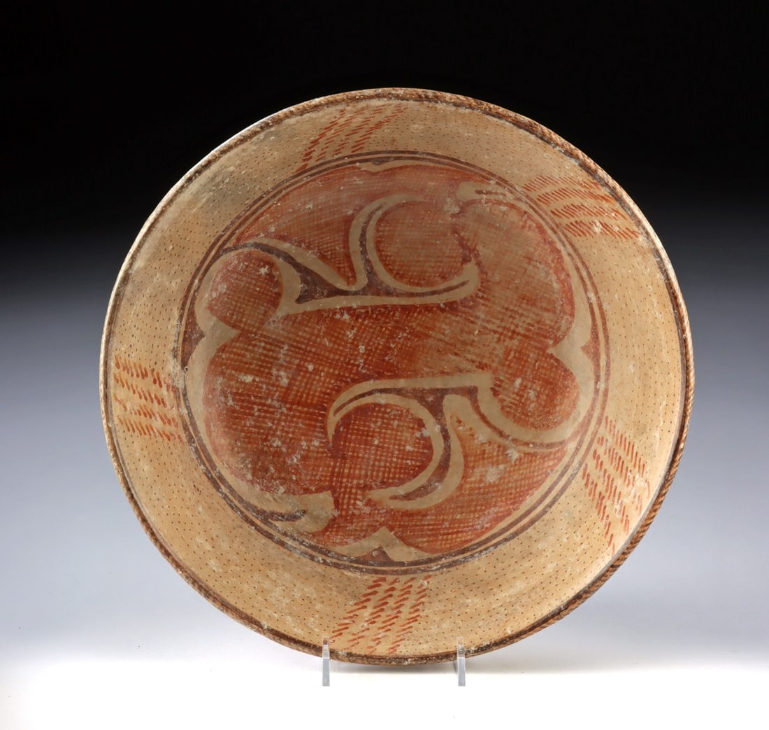Large Jalisco Pottery Bowl | Net and Woodgrain Motifs: Pre-Columbian, West Mexico, Jalisco, ca. 300 BCE to 300 CE. A large pottery bowl with a slightly rounded base and sloped walls, decorated in red and brown over a tan ground. The interior base shows an