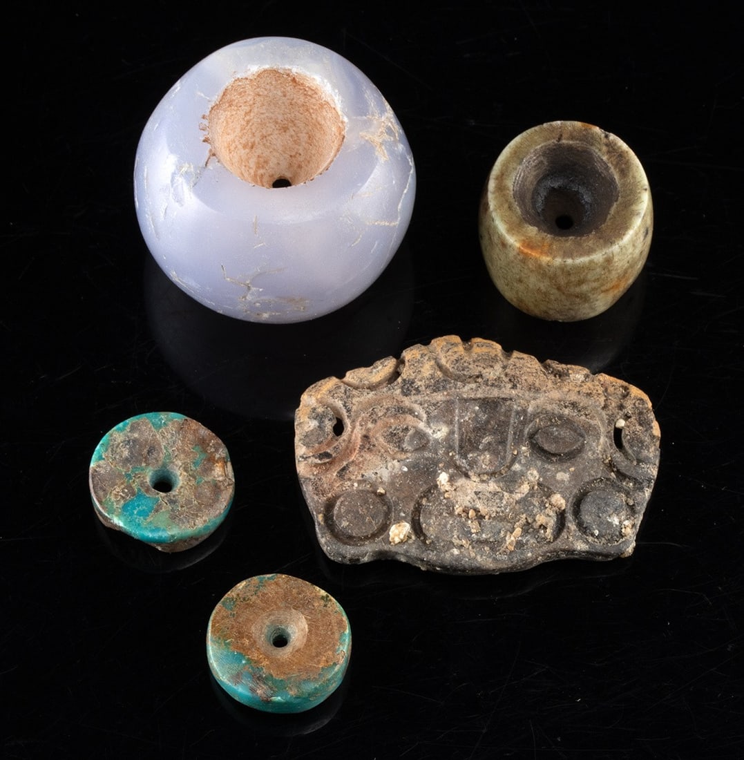 Maya Face Pendant with Chrysocolla & Chalcedony Beads: Pre-Columbian, Mesoamerica & Peru, ca. 300 BCE to 1500 CE. A group of 4 stone beads and a stone pendant. The Maya stone pendant features a stylized face wearing earspools. Included are two chrysocolla