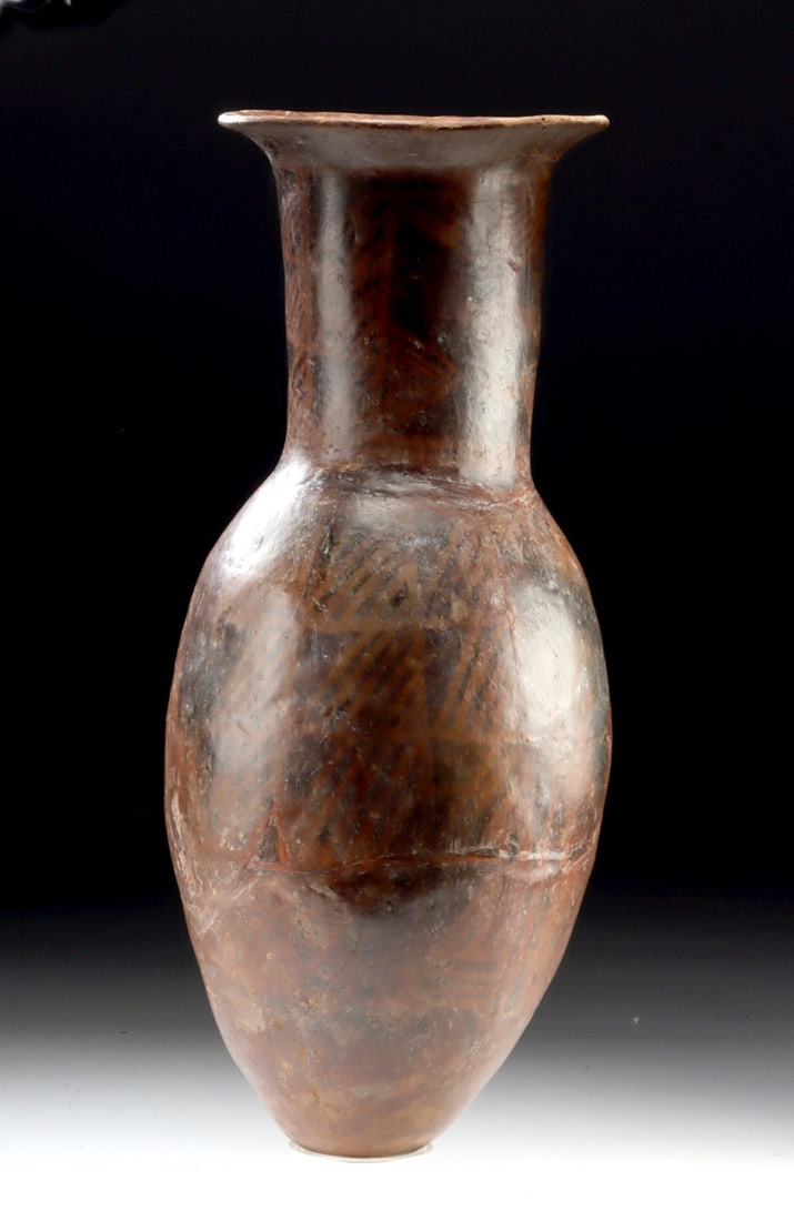 Large Narino Pottery Bullet Amphora w/ Geometric Motifs: Pre-Columbian, Colombia, Narino culture, ca. 750 to 1250 CE. A commanding Narino pottery amphora distinguished by its elegant bullet form and richly layered negative resist decoration, an object that