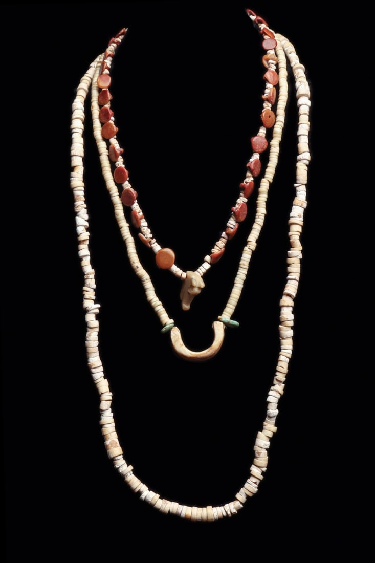 Pre-Columbian Shell & Stone Necklaces (3): Colombia, ca. 1000–1250 CE. Three different single strand necklaces, including a necklace composed entirely shell disc beads. Together with a necklace composed of shell disc beads and three turq