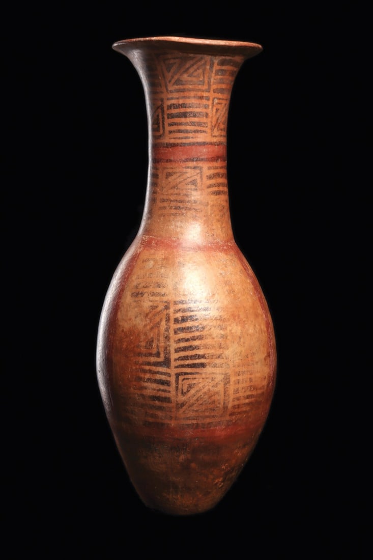 Narino Decorated Pottery Amphora: Narino, Colombia, ca. 800–1200 CE. A large, decorated pottery vessel having a slightly rounded, flat bottom and flared lip. Painted tan-cream ground with an overall black resist geometric decora