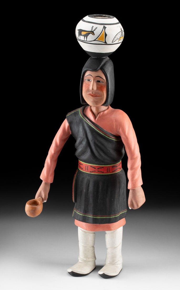 Walter Howato (Hopi, 1921-2003) Cottonwood Kachina | Woman with Pot & Ladle: Walter Howato (Native American, Hopi Pueblo, 1921-2003), ca. mid-20th century CE. A cottonwood Kachina-style figure standing with a painted pot upon her head and a ladle in her hand. Clad in tradition