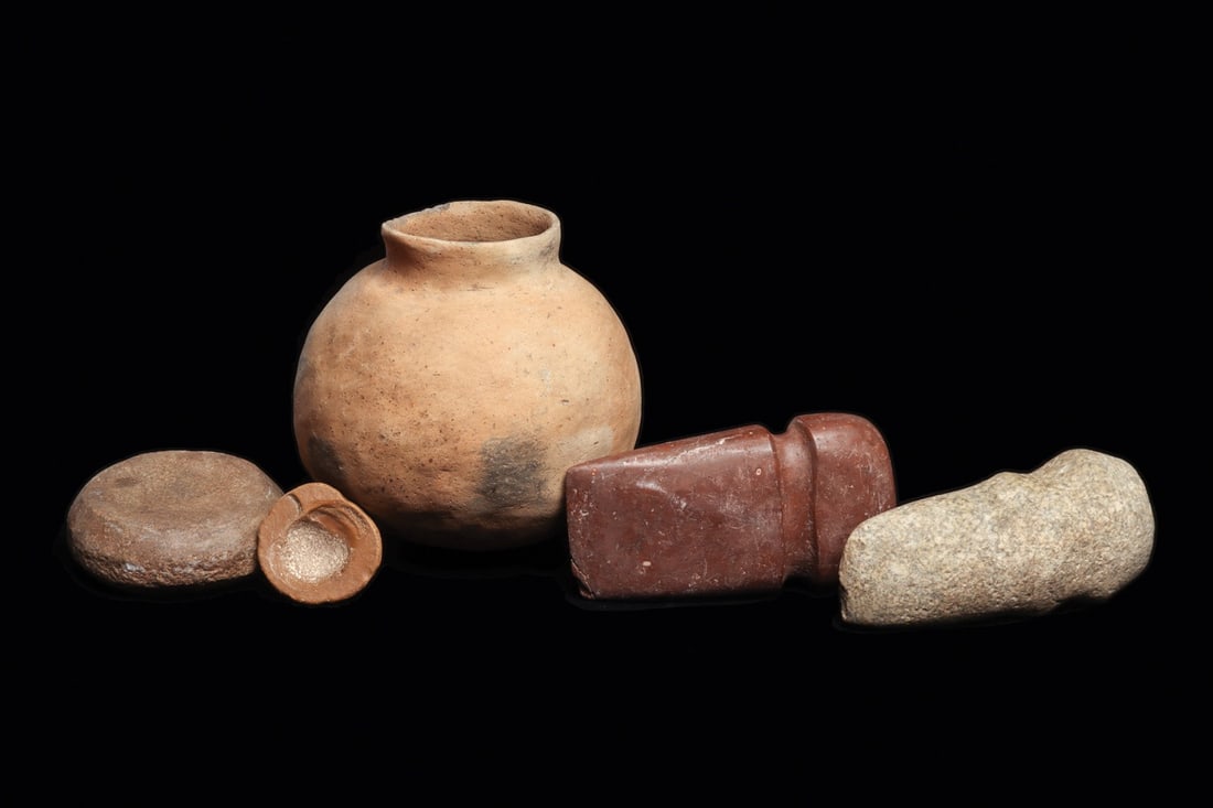 Native American Artifact Group (5): Central to southern USA, ca. 1000 CE. Group of five different examples including two different banded axe heads, the red-brown example is fully grooved. The speckled gray stone example is 3/4 grooved,