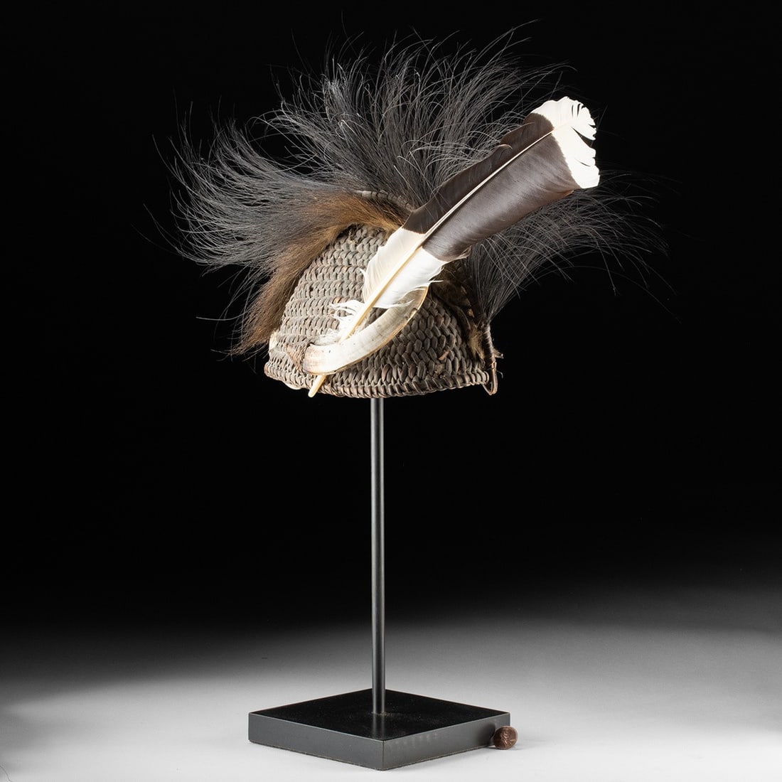 Naga Warrior's Woven Cane Headdress - Boar Tusks & Hornbill Feather: Asia, Northeast India / Northwest Myanmar, Naga peoples, ca. mid-20th century CE. A Naga warrior's hat from the Naga Hills region of northeastern India or northwestern Myanmar. The cap is woven from