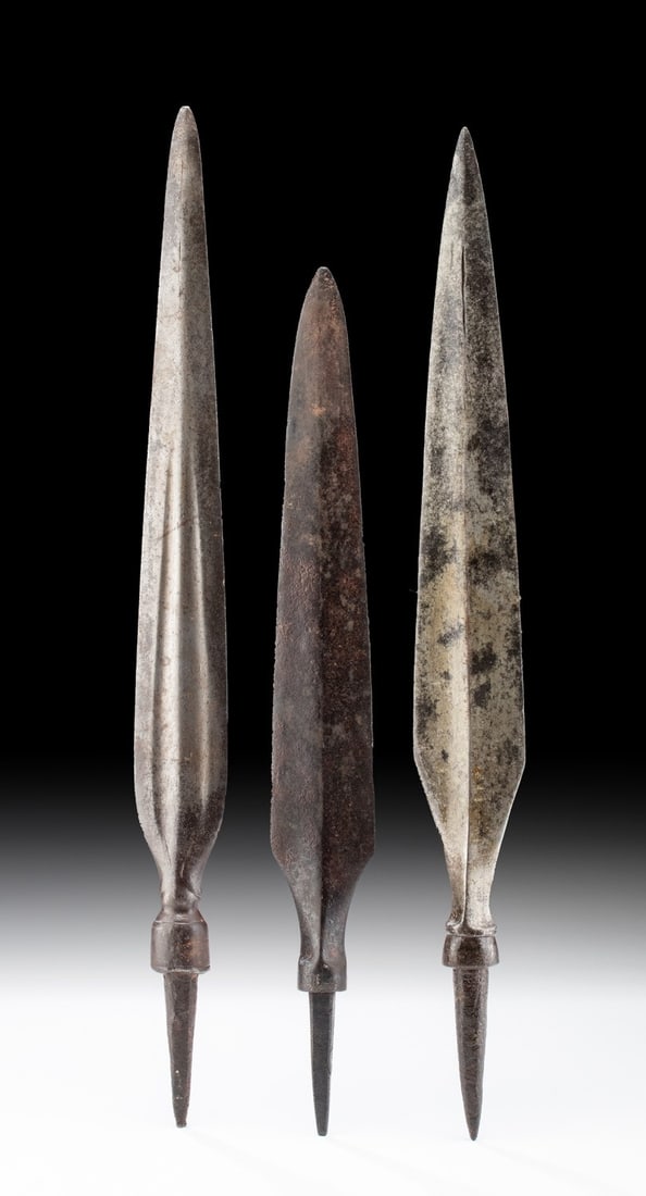 18th C. Bornean Iron Spear Heads (group of 3): Southeast Asia, Indonesia, Borneo, ca. late 18th to early 19th century CE. A fine set of three forged-iron spear blades that are likely of British origin. Each weapon bears a petaloid blade with a sha