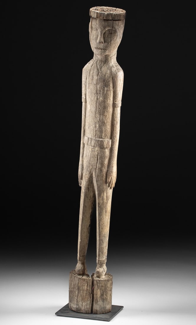 Rare Dayak Wood Hampatong Wearing Western Clothing: Southeast Asia, Indonesia, Borneo, Dayak culture, ca. A remarkable and unusual hampatong (also known as hempatong, tempatong, kepatong, or epatung) guardian figure, carved from a single hardwood