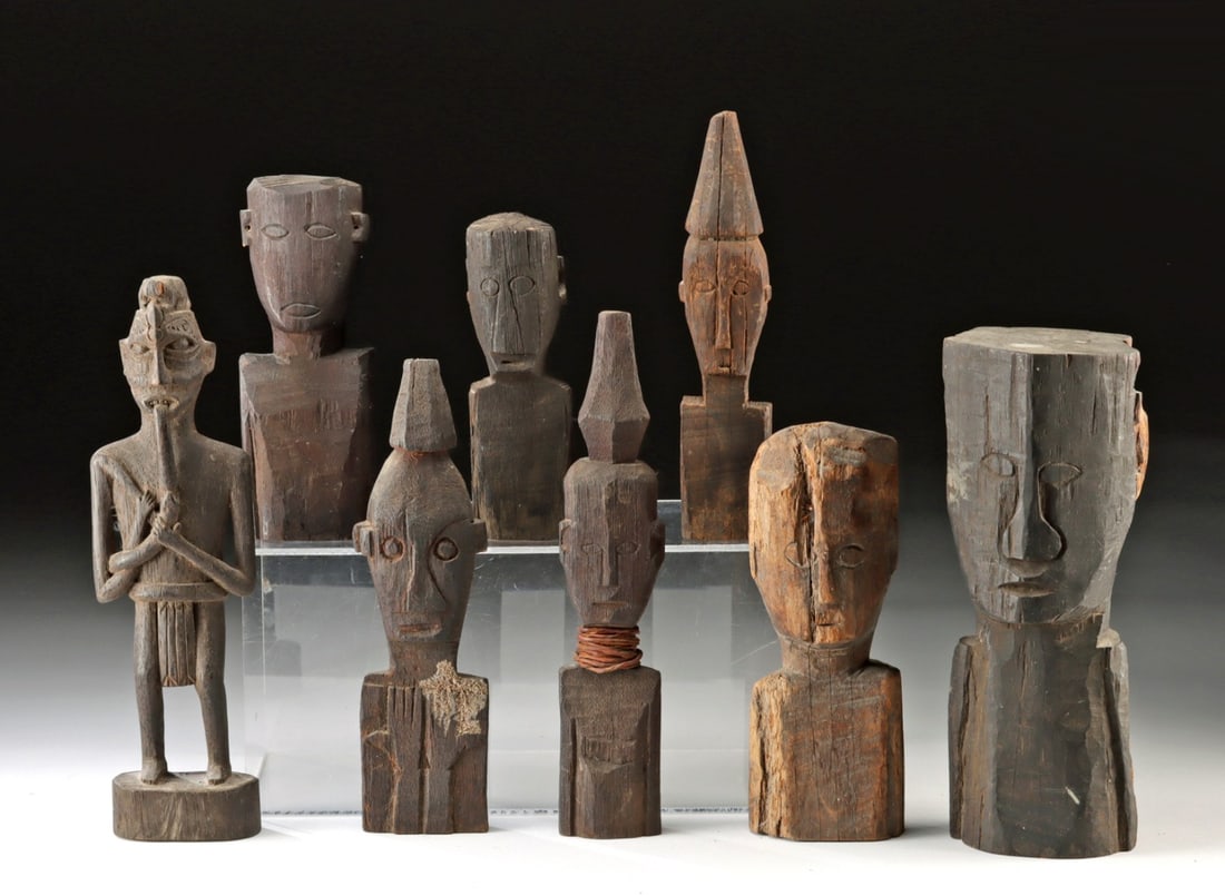 8 Indonesian Dayak Wood Hampatongs (Guardian Figures): Southeast Asia, Indonesia, Borneo, Dayak peoples, ca. mid to late 20th century CE. A collection of 8 and-carved wooden figures that represent guardians, known as Hampatong. One figure is standing with