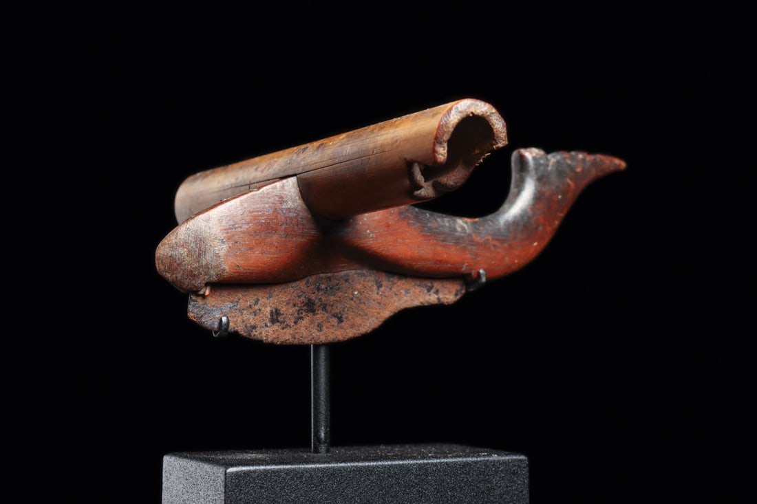 Dayak Tobacco Leaf Cutter: Borneo, Indonesia, ca. 19th century. Carved bamboo handle fitted with a wood and iron alloy blade used for slicing tobacco leaves. The handle is skillfully fashioned in the form of a stylized fish or