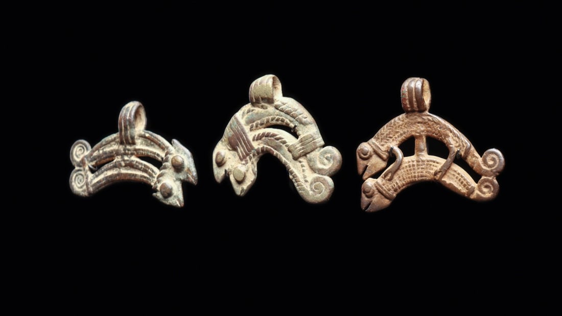 Three Chameleon Pendants Lobi/Volta: Burkina Faso. Group of three copper alloy pendants featuring mating chameleons stacked upon each other, with coiled tails and textured detail. Green and brown patinas with some deposits. . Each on