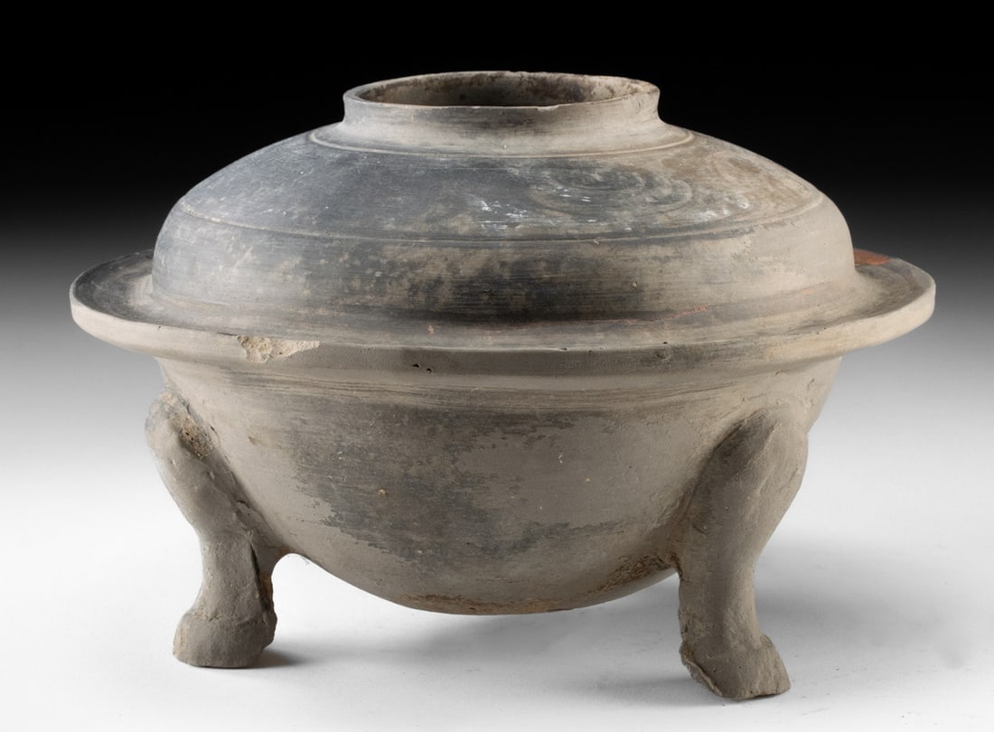 Han Dynasty Pottery Ding Tripod Vessel | Traces of Pigment: East Asia, China, Han Dynasty, ca. 206 BCE to 220 CE. A pottery tripod ding vessel with a low, rounded bowl set on three legs and a broad, outward-flanged rim surrounding a short, upright neck. The su