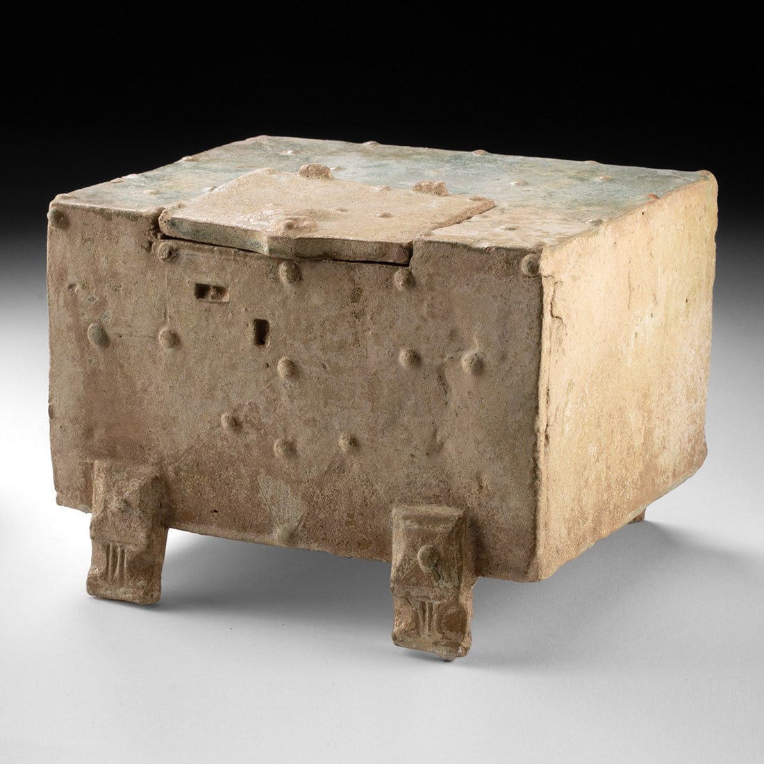 Han Dynasty Green-Glazed Earthenware Mingqi Chest: China, Han Dynasty, ca. 206 BCE to 220 CE. A miniature chest modeled in earthenware and enlivened with raised studding, a removable panel door, and traces of emerald green lead glaze with earthen accr