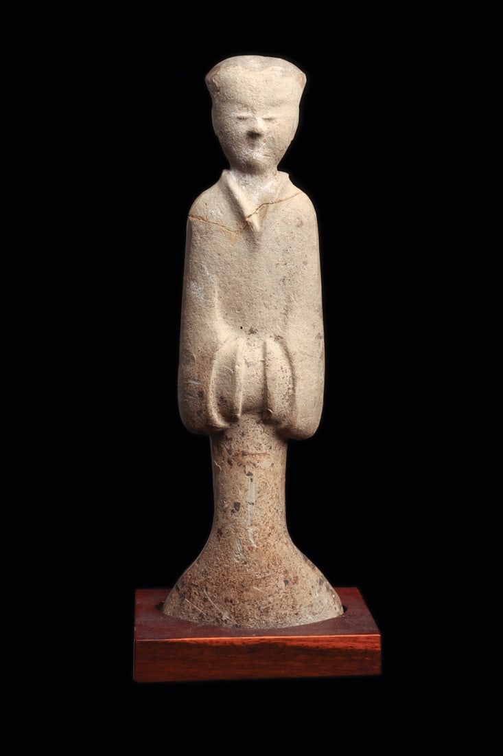 Han Dynasty Female Pottery Attendant: China, han Dynasty, ca. 206 BCE – 220 CE. Molded pottery tall slender standing attendant figure, wearing a long flowing robe with a fish-tail type wide bottom, hair bulled back into a rear bun. 
