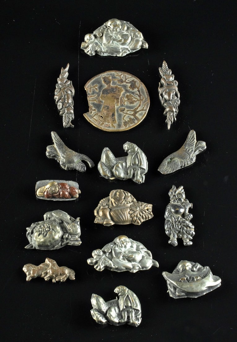 Japanese Edo / Meiji Menuki (Sword Hilt Ornaments): East Asia, Japan, Edo to Meiji period, ca. 18th to 19th century CE. A collection of brass and copper cast ornaments for tobacco pouches known as maekanagu, and sword grip ornaments known as menuki, wi