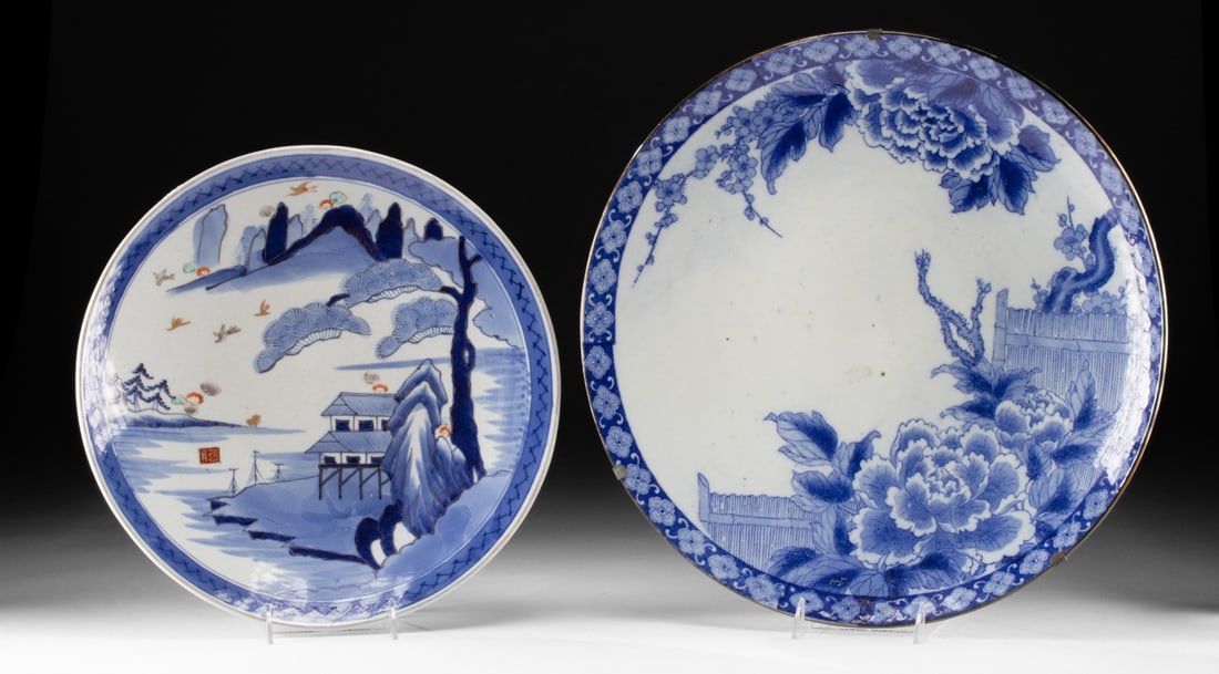 Two Large Japanese Blue on White Porcelain Chargers: East Asia, Japan, Meiji to Taisho period, ca. early 20th century CE. A lovely matched pair of Japanese porcelain chargers, one rendered in vivid underglaze blue with iron red, gray, pale green, and gi