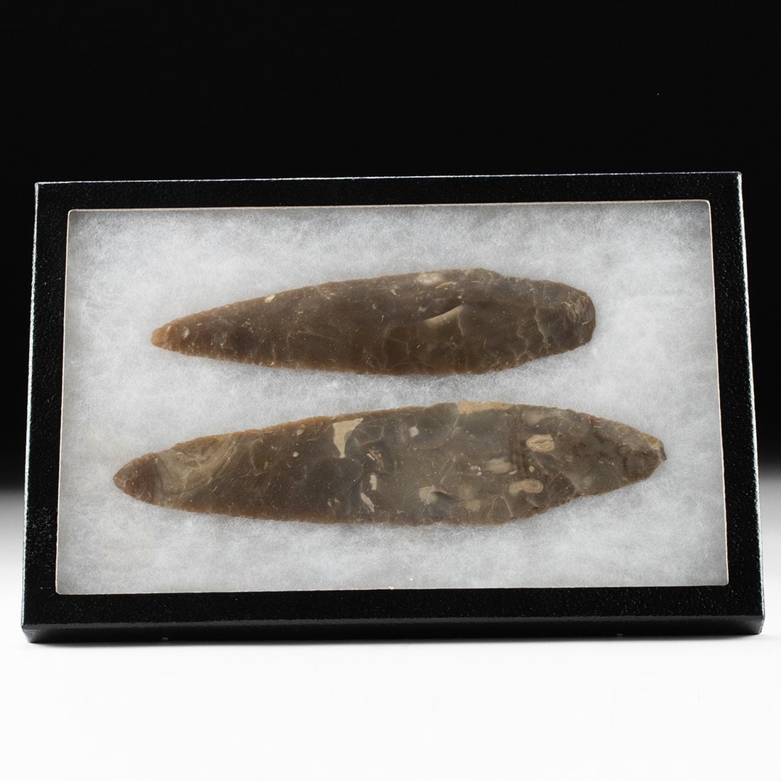 2 Maya Chert Stone Blades: Pre-Columbian, Maya Territories, Belize, ca. 500 - 1000 CE. A refined pair of medium-brown chert blades whose glossy, rippling flake scars testify to expert craftsmanship and lend a striking visual rh