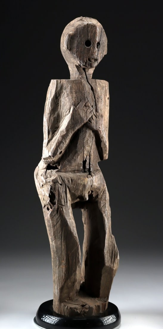 Borneo Dayak Wood Ancestor Guardian Figure: Southeast Asia, Indonesia, Borneo, Iban Dayak, ca. mid-20th century CE. Crafted from hardwood, this figure represents an honored Dyak ancestor, a hampatong, traditionally used for protection. It serve