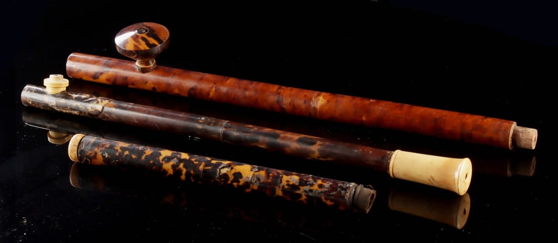 19th C. Chinese Smoking Pipes, Tortoiseshell & Ivory: East Asia, China, Qing Dynasty, ca. 19th to early 20th century CE. A collection of three antique smoking pipes with mottled tortoiseshell veneers and elephant ivory fittings, reflecting the luxury mat