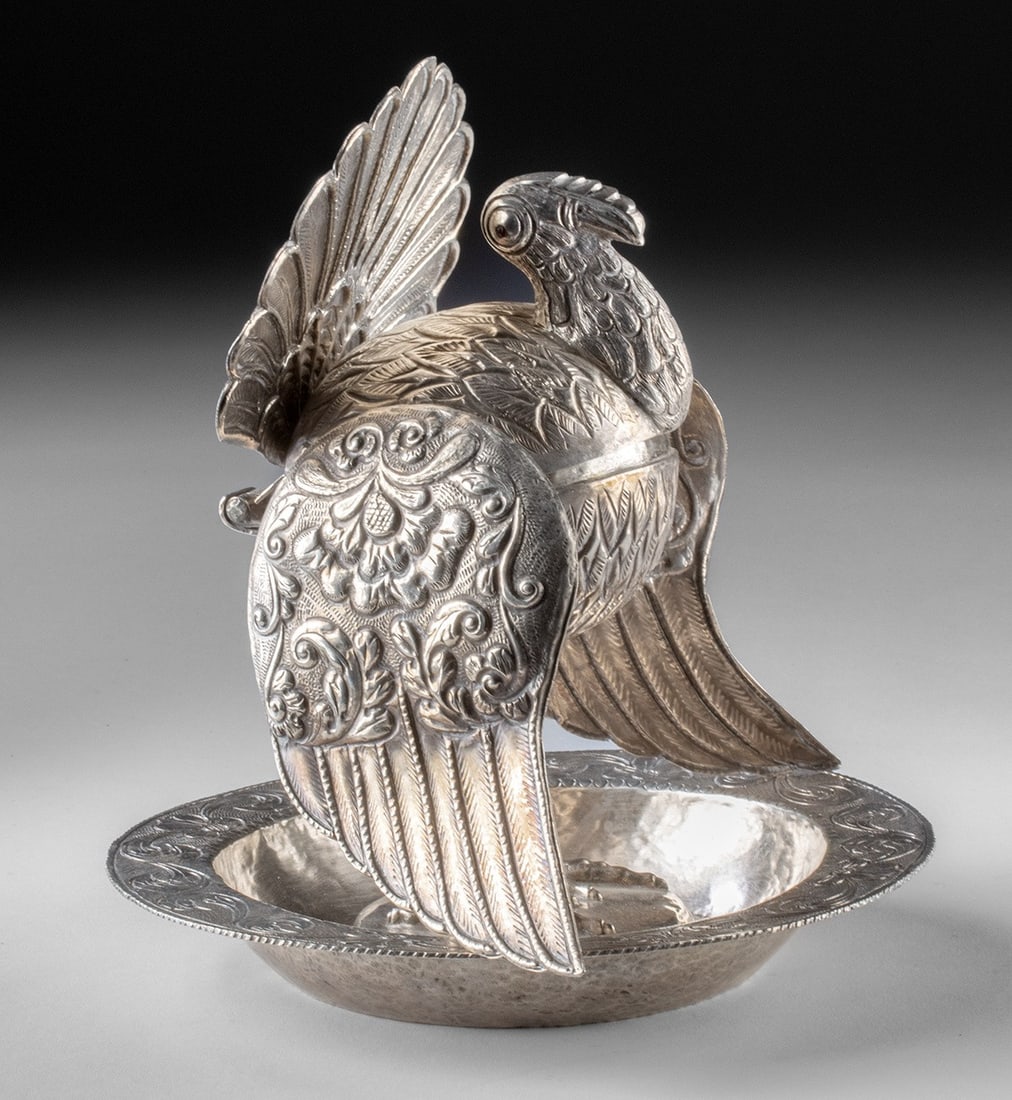 Colonial Peruvian Silver Turkey Effigy Incense Burner, ex-Holler & Saunders: South America, Peru, ca. 1800 - 1899 CE. A silver sahumador incense burner formed as a turkey with a rounded body raised on slender legs above a shallow dish base. The domed body opens on a hinge, rev