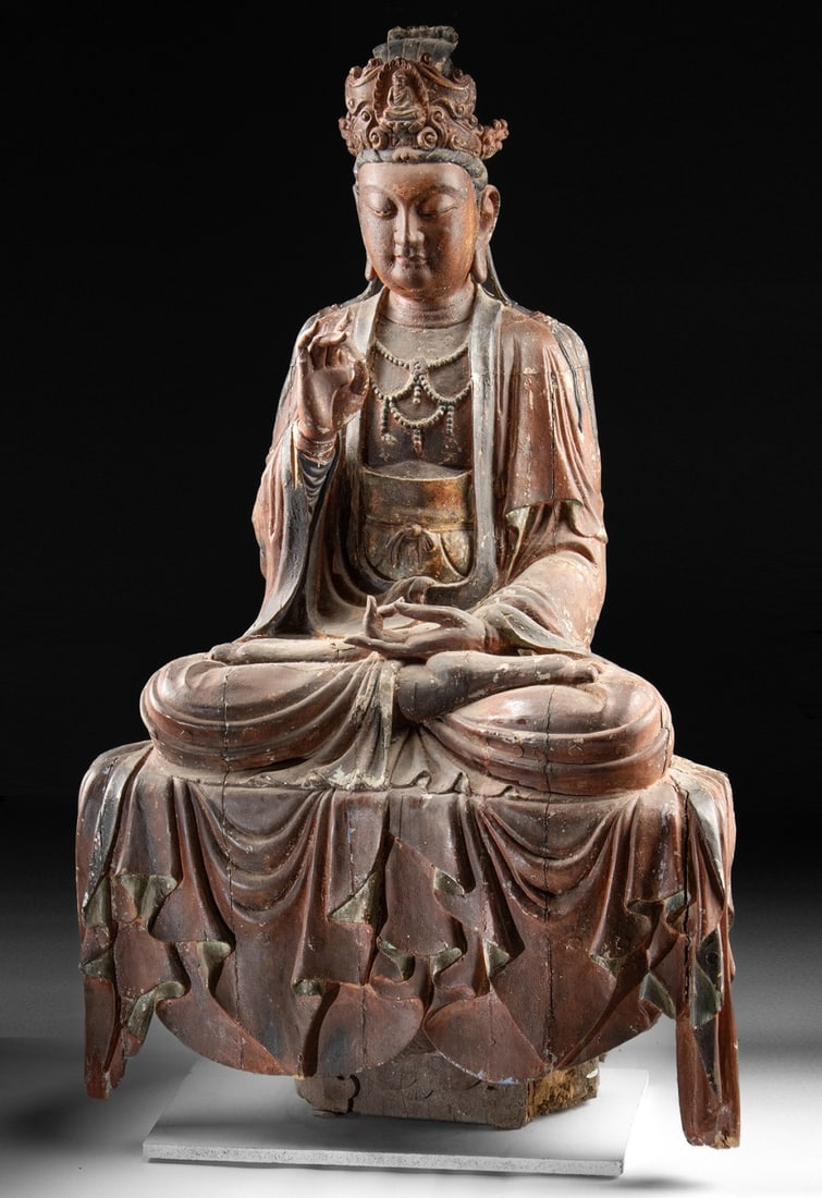 Monumental 17th C. Chinese Wood Sculpture of Guanyin: East Asia, China, late Ming to early Qing Dynasty, ca. 1600 - 1799 CE. A nearly life-sized wood sculpture of Guanyin (Avalokiteshvara), the Bodhisattva of Compassion, shown seated in meditation on a c